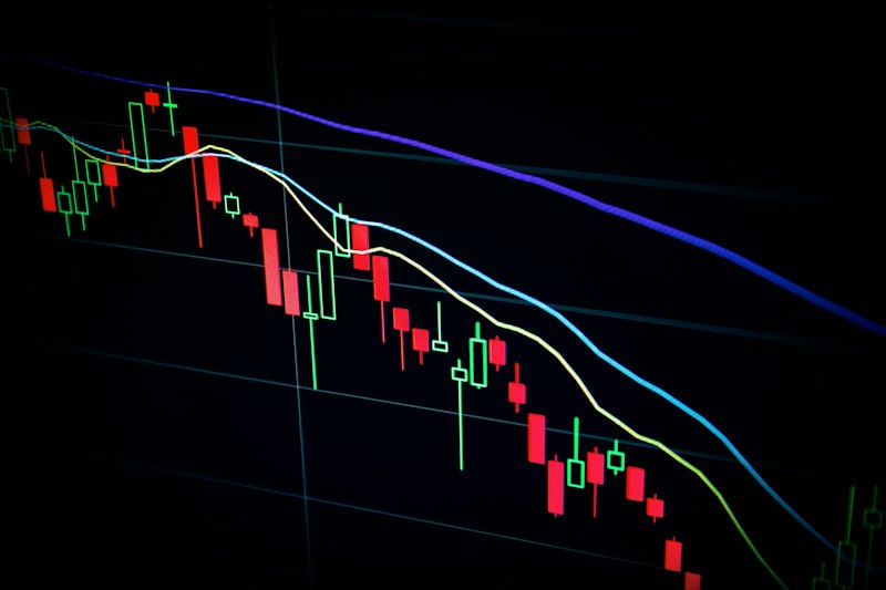 Financial advisor reviewing investment portfolio charts and graphs on computer screen